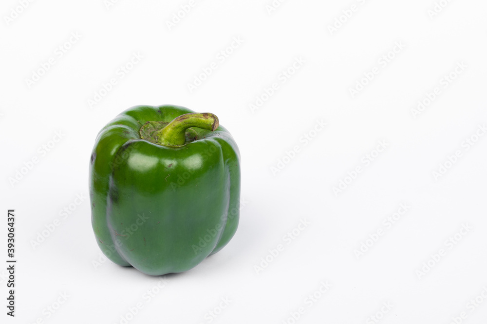 Green fresh capsicum vegetable on white background Green fresh capsicum vegetable on white background