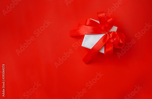 gift box with bow on a red background