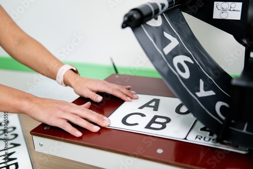 production of numbers for a car on a machine