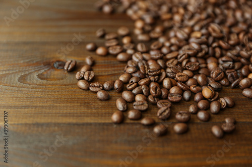 roasted coffee beans on dark wooden background