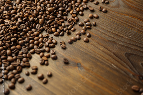 roasted coffee beans on dark wooden background