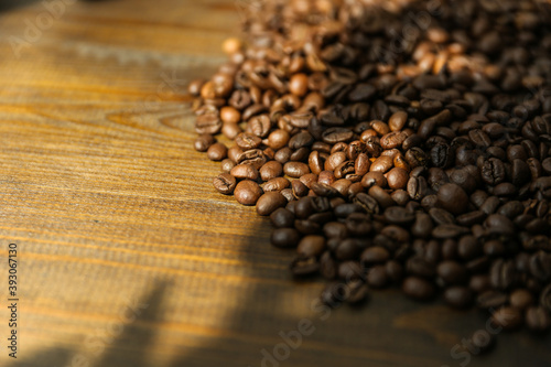 roasted coffee beans on dark wooden background