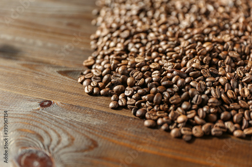 roasted coffee beans on dark wooden background