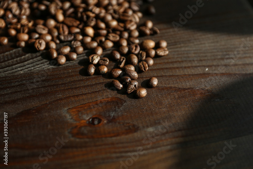 roasted coffee beans on dark wooden background