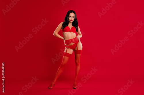 Full body photo of luxury elegant brunette young lady hands on waist confident look isolated on red color background