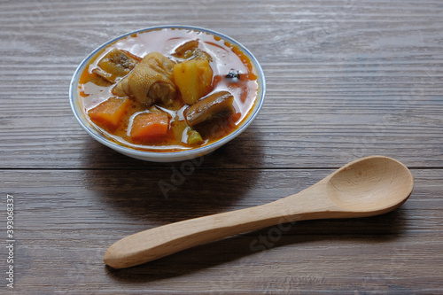 Dalcha in the plate on the table. photo