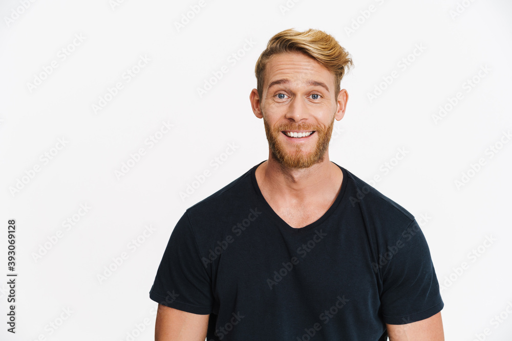 Cheerful caucasian blonde man posing and smiling at camera Cheerful caucasian blonde man posing and smiling at camera