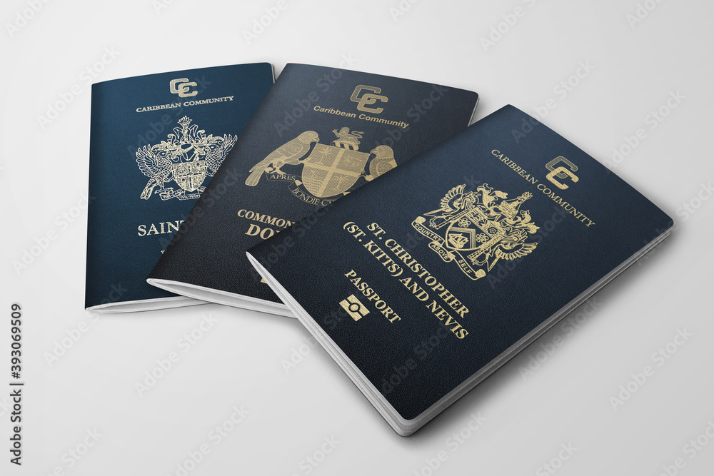 three passports saint kitts and Nevis and Dominica and saint Lucia on grey background three passports saint kitts and Nevis and Dominica and saint Lucia on grey background