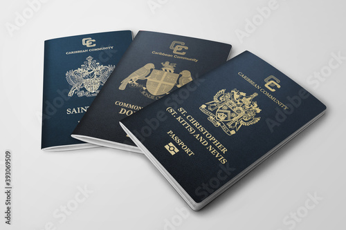 three passports saint kitts and Nevis and Dominica and saint Lucia on grey background