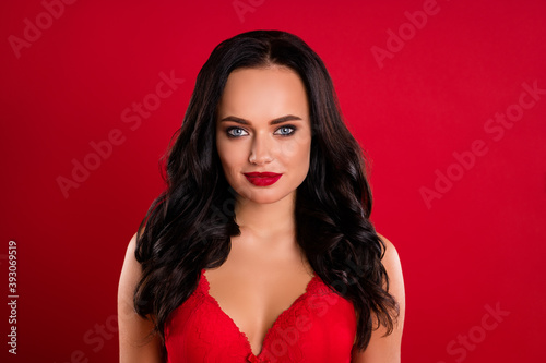 Portrait of pretty brown hairdo girl snow maiden wear bright bra isolated on red color background