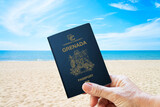 grenada passport with a sea and beach background