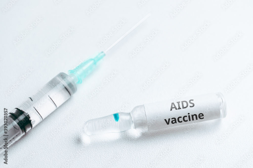 AIDS vaccine concept in ampoule and syringe AIDS vaccine concept in ampoule and syringe
