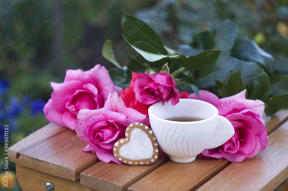 cup of coffee, heart shaped cookies, bouquet of pink roses. with love.