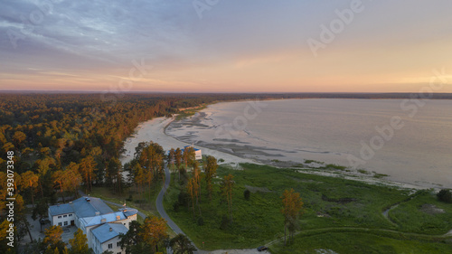 Aerial view shot of a beautiful sunrise over the Vosu resort in Lahemaa, Estonia photo