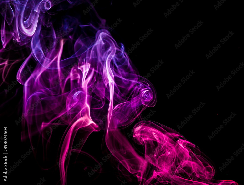 Colored smoke on black background