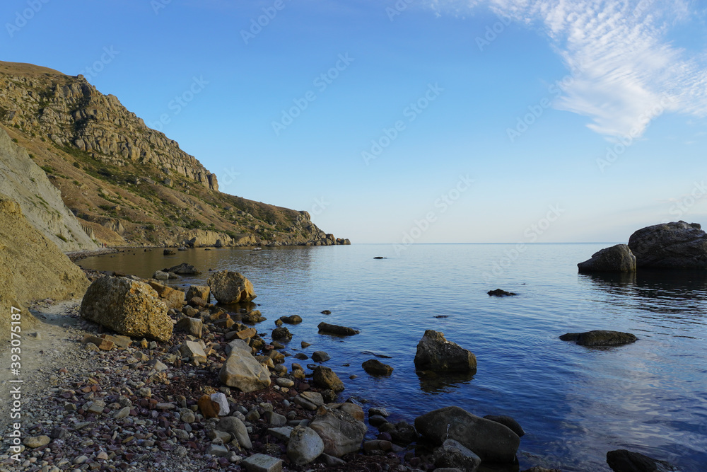 Mountain sea bay panorama. Beautiful Crimean nature landscape. Beautiful seashore with different stones.