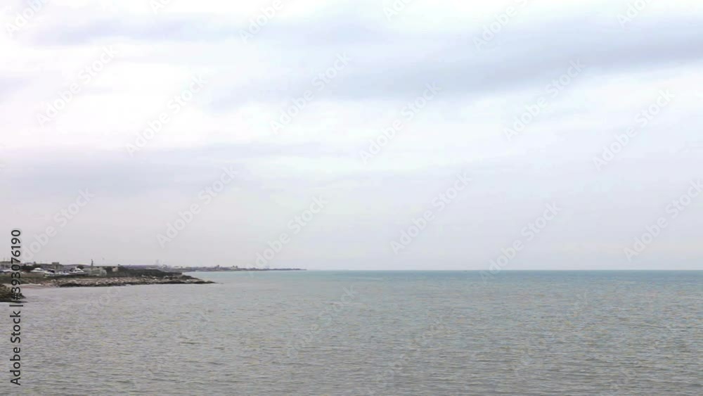The Swabian castle of the city of Trani controls the sea with mighty walls and watchtowers The Swabian castle of the city of Trani controls the sea with mighty walls and watchtowers