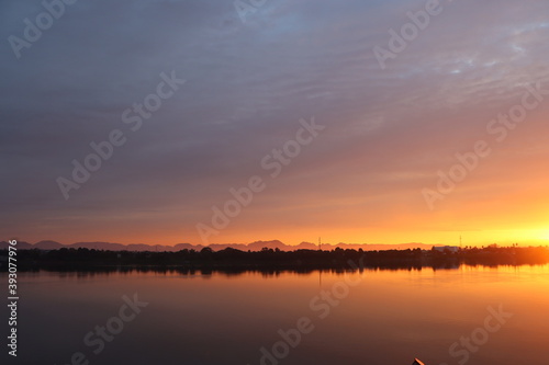 Fototapeta Naklejka Na Ścianę i Meble -  Long morning sunrise along the Mekong River bank