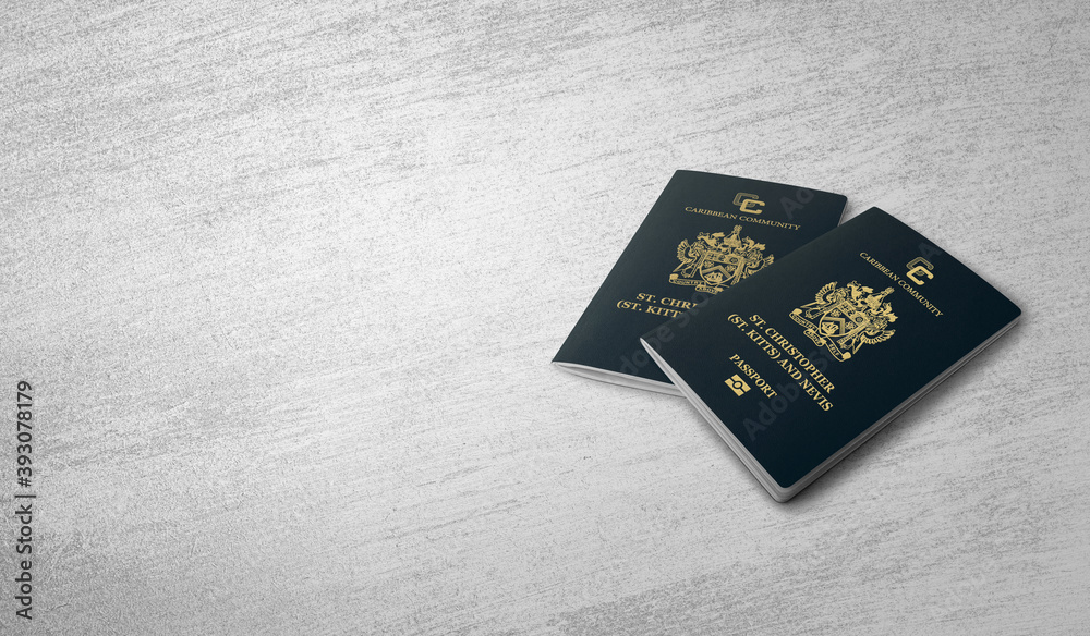 two saint kitts and Nevis passports On a concrete floor two saint kitts and Nevis passports On a concrete floor