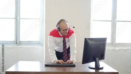 creative man in a suit red cloak at office. Manager with coat of superman. Superhero in business or . customer service concept for assistance, contact us, helpdesk, helpline and business support