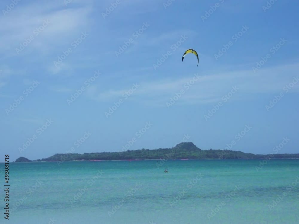 White sand beach on Cuyo island. Philippines. Kite surfer at sea. White sand beach on Cuyo island. Philippines. Kite surfer at sea.