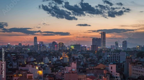 Zoom out time lapse view of sunset over Hanoi, the capital and second largest city of Vietnam.  photo