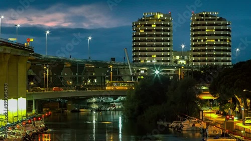 Port-canal of Pescara  seen at night from the Ponte del Mare. In the background the Camuzzi Towers