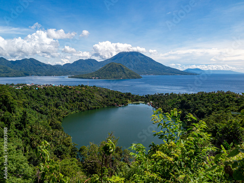 Scenic view of a lake in the jungle with the ocean and vulcan islands in background