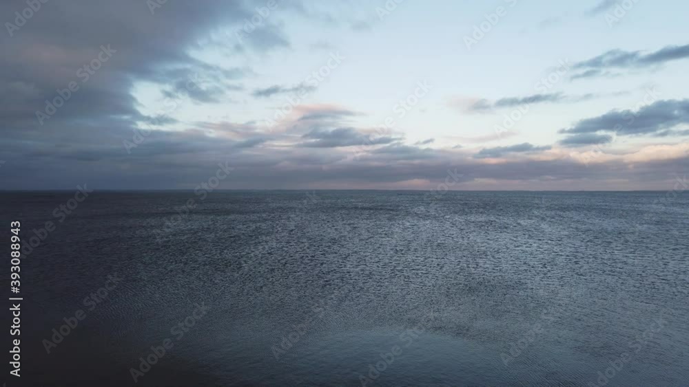 calm blue water surface with small waves