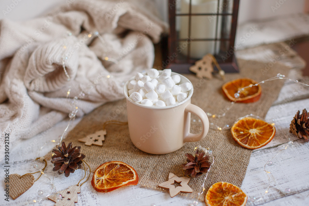Christmas composition, mug with cocoa and marmalade on a wooden background Christmas composition, mug with cocoa and marmalade on a wooden background