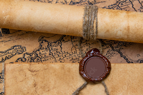 An old paper scroll sealed with a wax seal. The manuscript is rolled up and sealed.