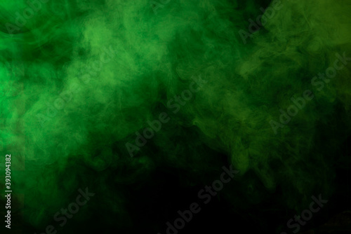 Green smoke on black background