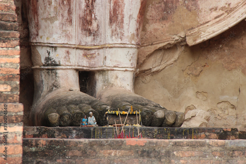 statue of buddha in a ruined temple (wat mahathat) in sukhothai in (thailand)