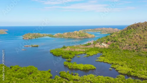 Tropical island with sandy beach on the Zamboanga Peninsula. Sallangan Islands, Simoadang Island. Mindanao, Philippines. photo