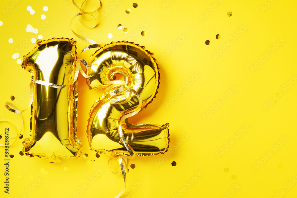 Gold foil balloon number, digit twelve. Birthday greeting card, inscription 12. Anniversary celebration event. Banner. Stylish golden numeral, bright shiny glitter, yellow background. Numerical digit