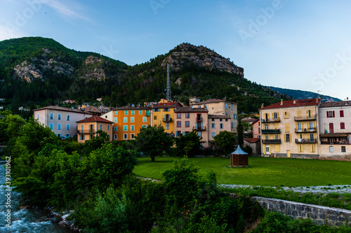 A picturesque wide angle view of a French alpine medieval village during sunset in summer (Puget-Theniers, Alpes-Maritimes, Provence-Alpes-Cote-d'Azur, France)