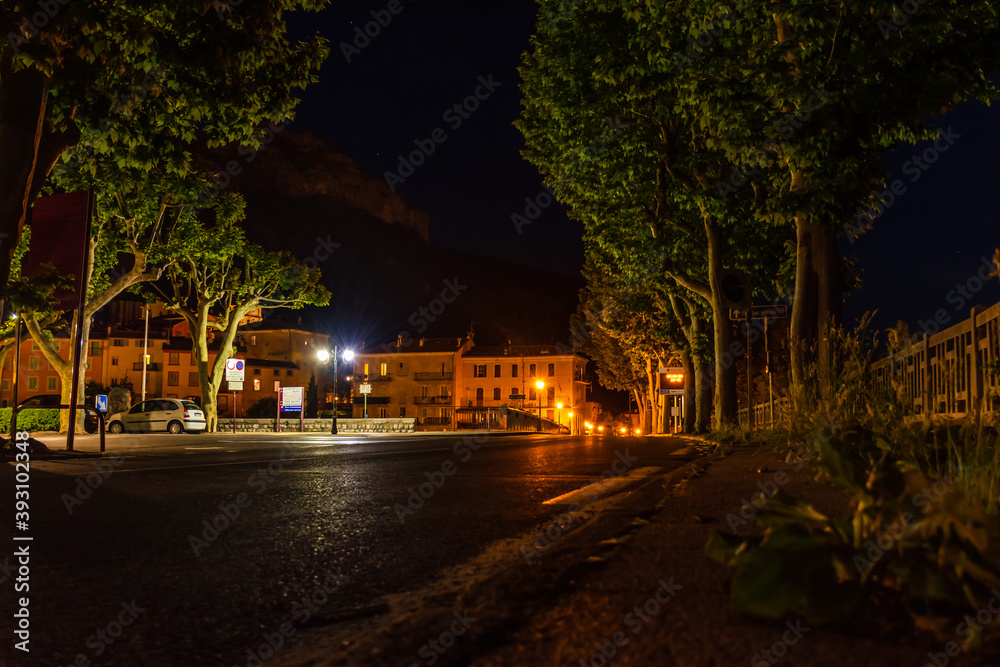 A picturesque view of a road in a French medieval alpine village at night (Puget-Theniers, Alpes-Maritimes, Provence-Alpes-Cote-d'Azur, France)