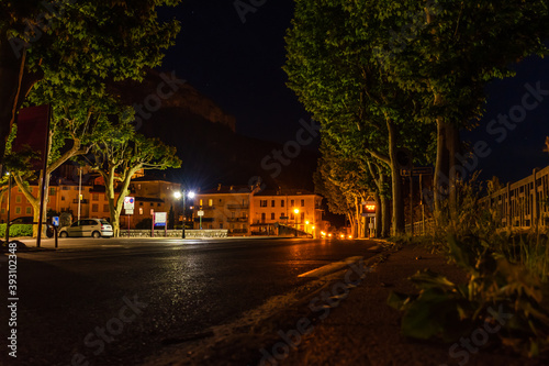 A picturesque view of a road in a French medieval alpine village at night (Puget-Theniers, Alpes-Maritimes, Provence-Alpes-Cote-d'Azur, France)