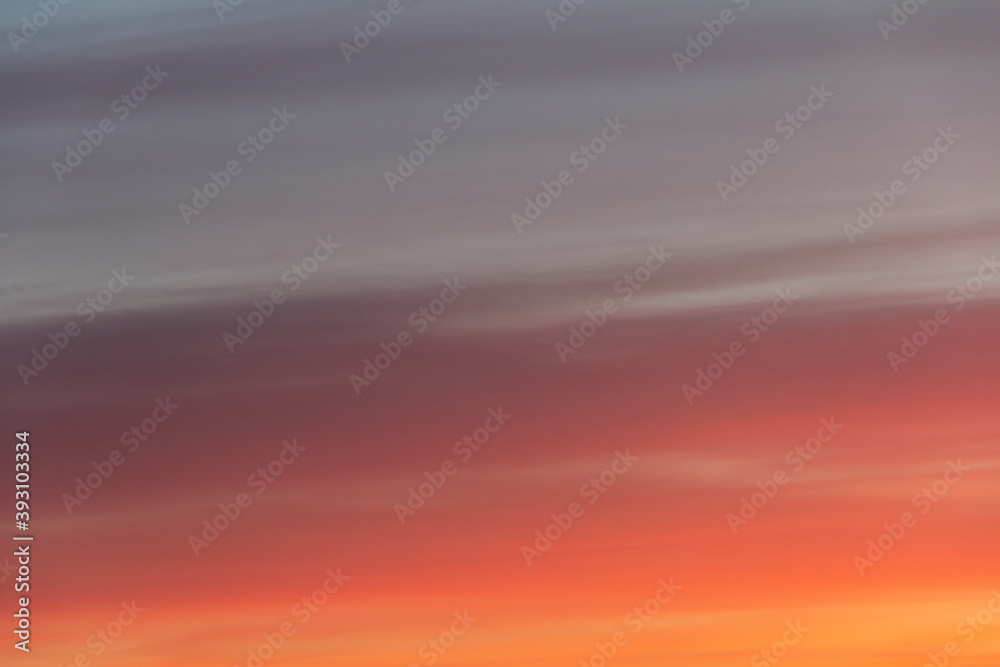 Wonderful autumn evening sky of various pleasant colors (blue, purple, pink, orange, yellow) at sunset