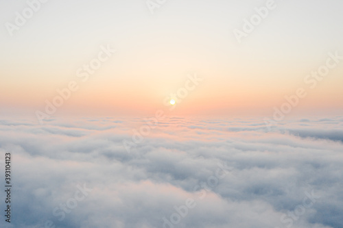 Fototapeta Naklejka Na Ścianę i Meble -  View of above the clouds during the sunrise