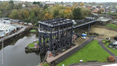 Industrial Victorian Anderton canal boat lift Aerial view River Weaver rising tilt down push in photo