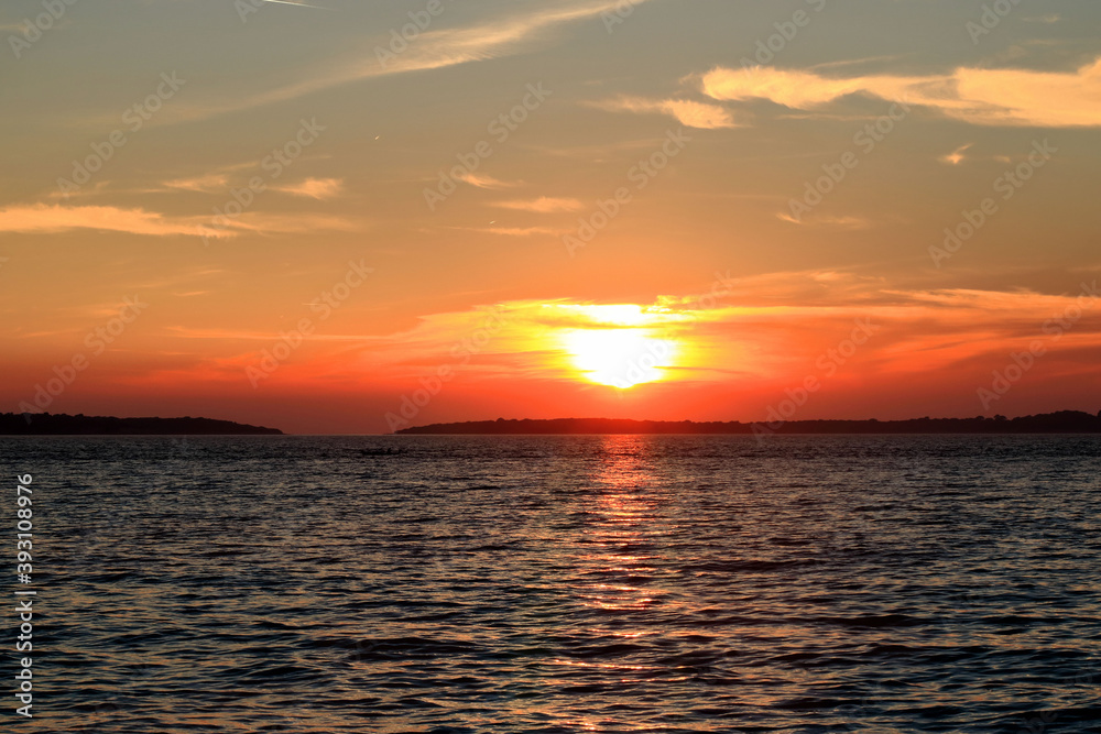 lovely sundown reflecting in the sea in Fazana, Croatia