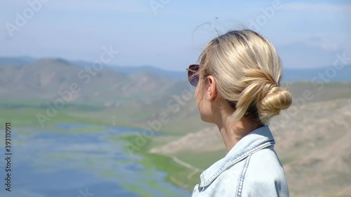 Beautiful girl on Lake Baikal in summer