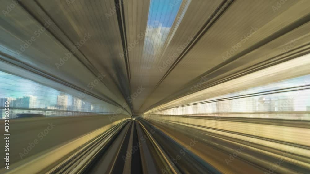 4K point of view Hyperlapse time-lapse of automated train moving forward crossing Rainbow bridge to Odaiba in Tokyo, Japan. Advanced transportation system.