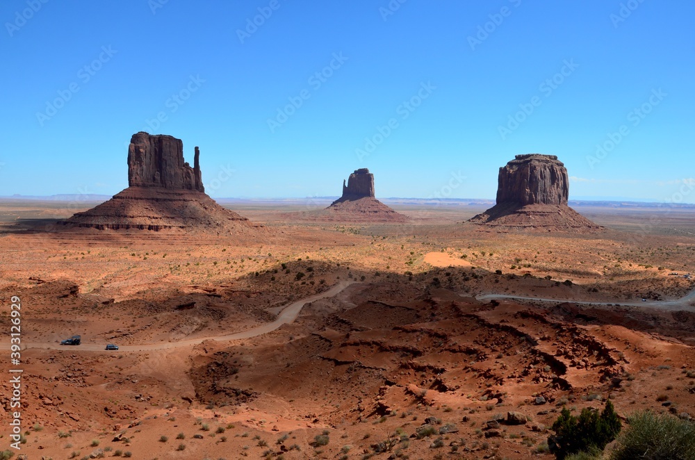 Monument Valley in Arizona, USA, with partial shadow, west mitten butte, east mitten butte, Merrick butte, Navajo Nation Reservation, afternoon light Monument Valley in Arizona, USA, with partial shadow, west mitten butte, east mitten butte, Merrick butte, Navajo Nation Reservation, afternoon light
