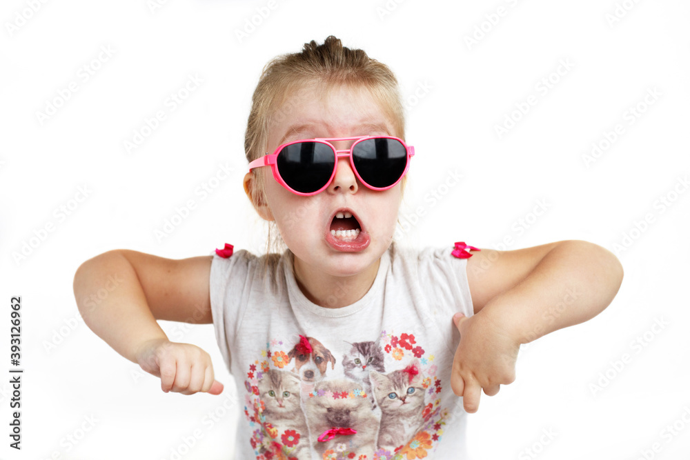 Child in pink sunglasses making funny face. positive girl shouts on a white background Child in pink sunglasses making funny face. positive girl shouts on a white background
