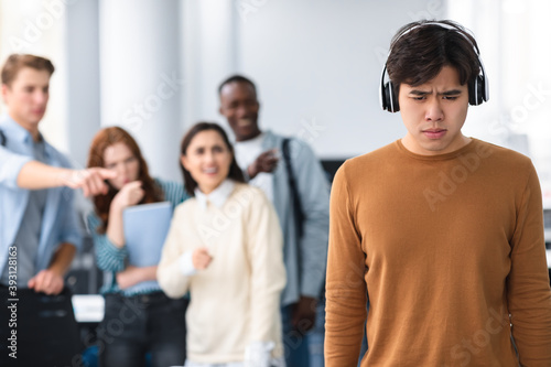 People mocking and making fun of sad asian guy