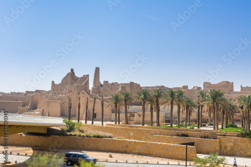 Palm trees and Ruins of Diraiyah, also as Dereyeh and Dariyya, a town in Riyadh, Saudi Arabia, was the original home of the Saudi royal family, and served as the capital of the Emirate of Diriyah. photo