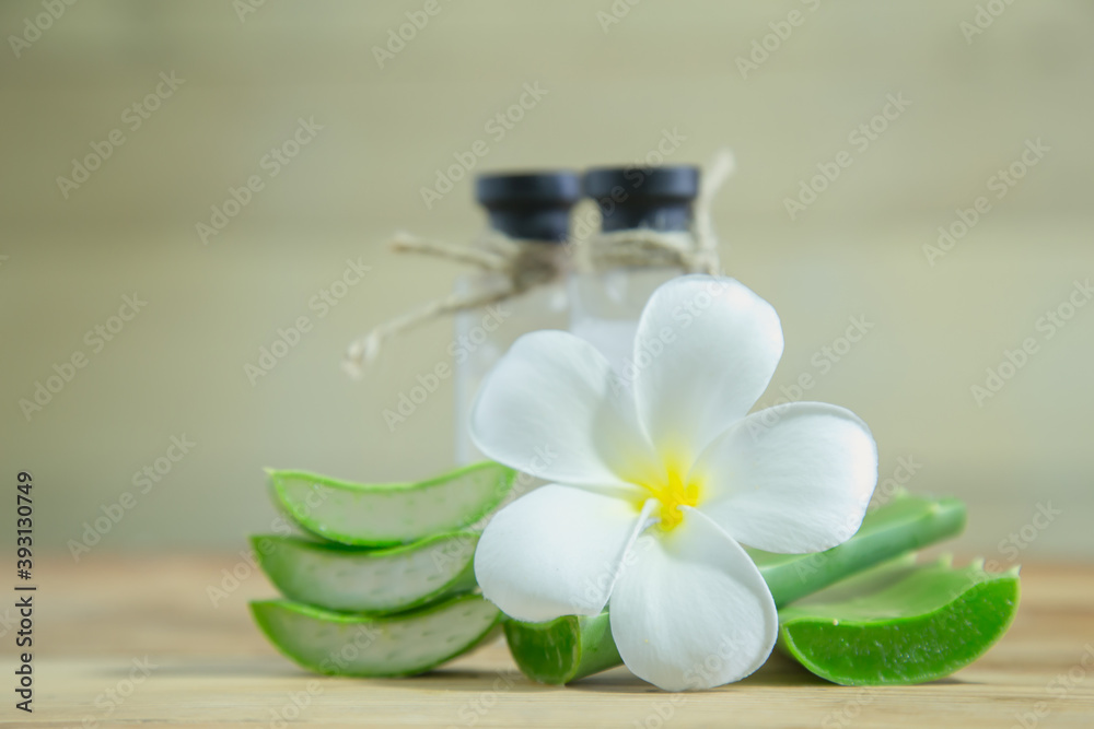 Aloe vera Fresh stacked with drop water and aloe vera juice in glass bowl with honey in jar on old wood Aloe vera Fresh stacked with drop water and aloe vera juice in glass bowl with honey in jar on old wood