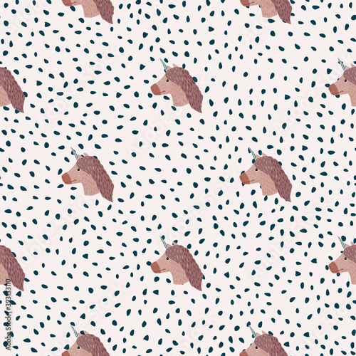 Simple brown unicorn faces seamless doodle pattern. White backround with dots. Baby sweet animal print.